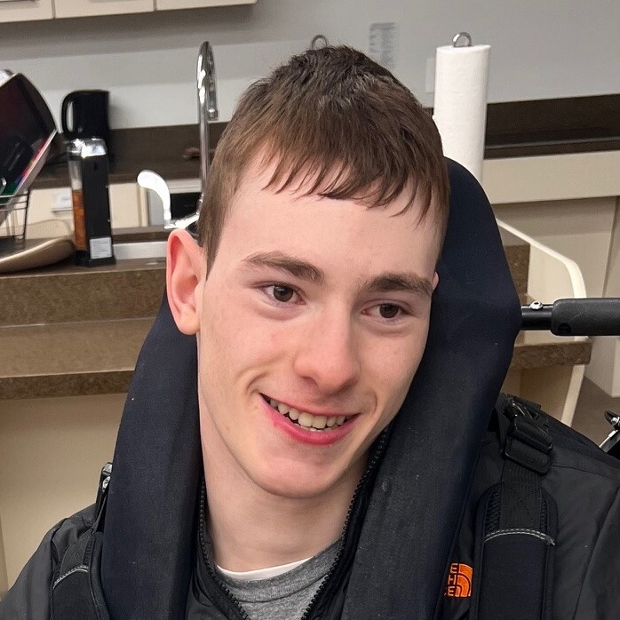 A picture of CEL member Drew smiling during kitchen activity.