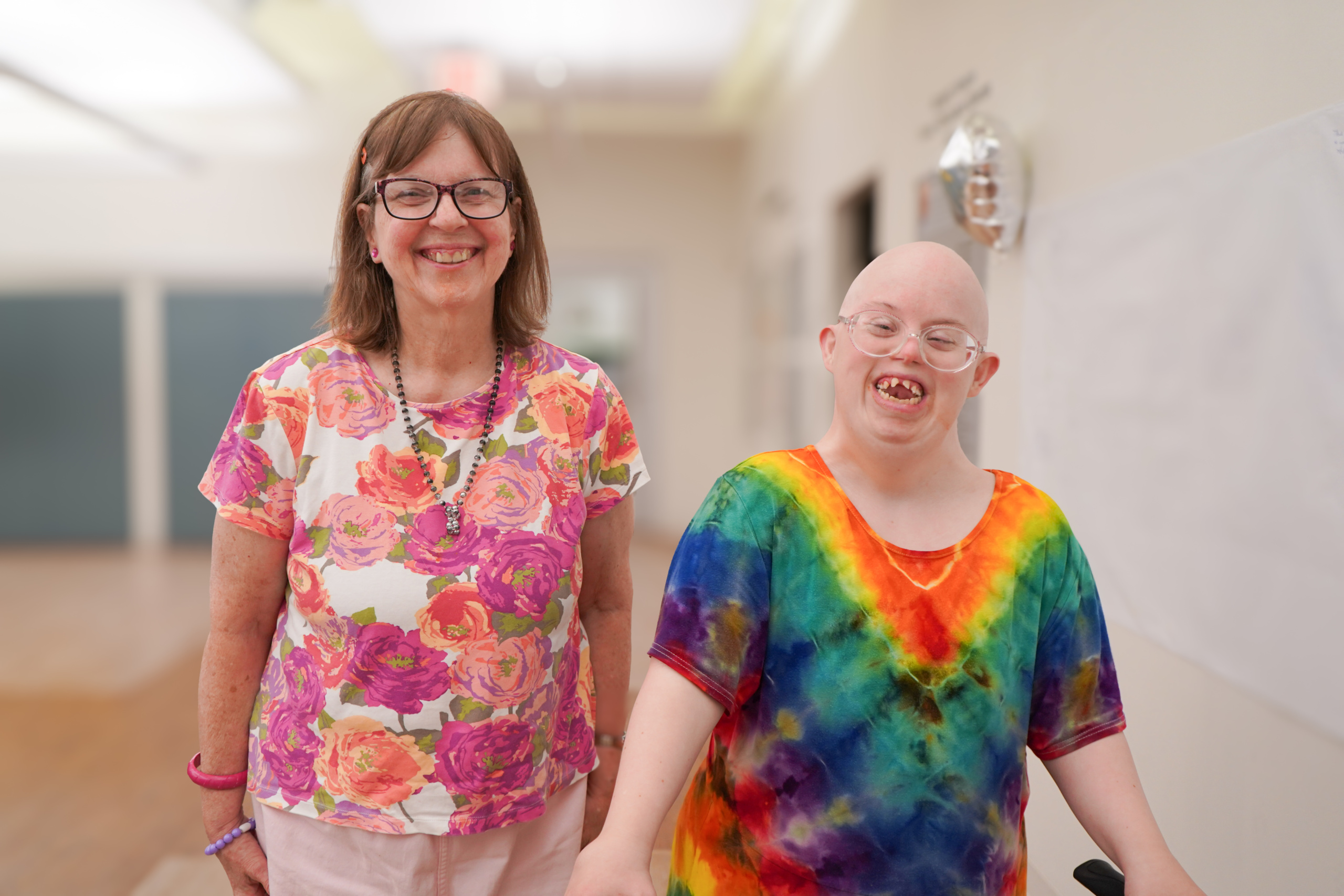 A volunteer and member smile at CEL