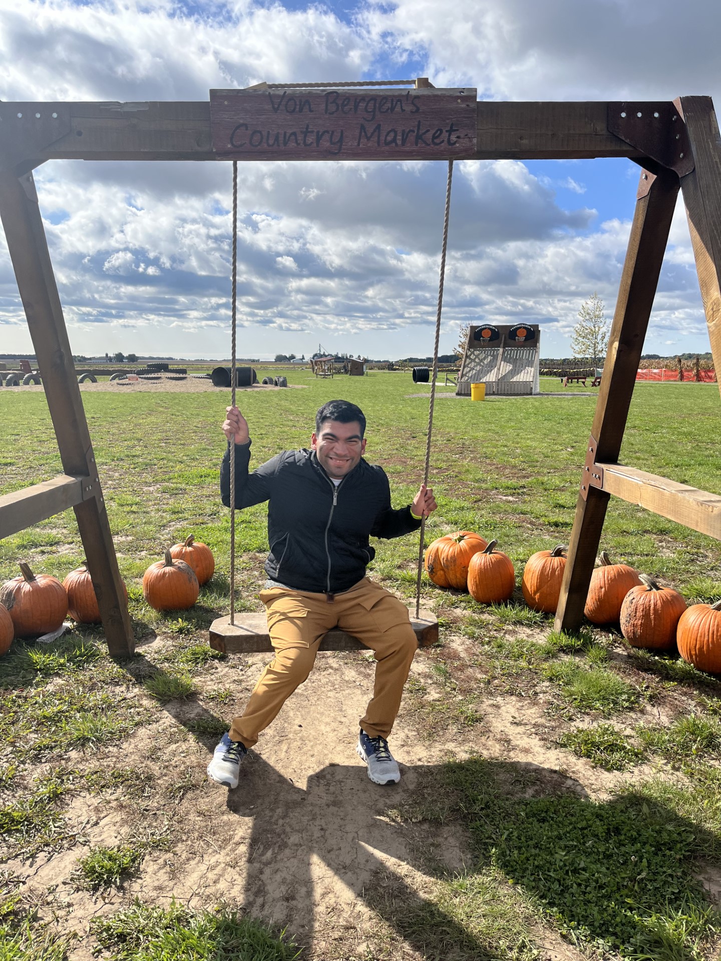 CEL member Sebastian o swing smiling during pumpkin patch visit.
