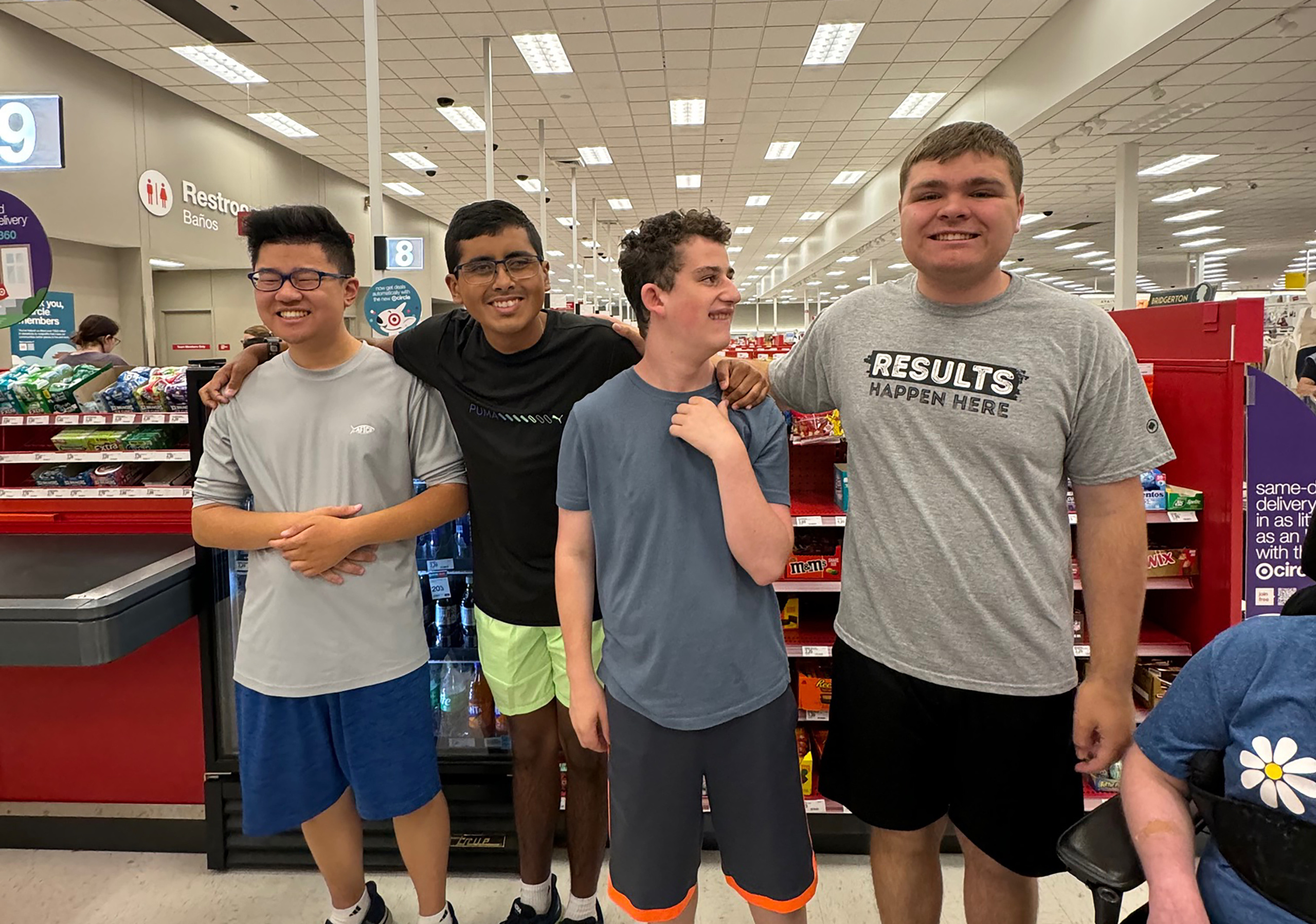 A group of CEL summer camp members smiling as they visit Target.