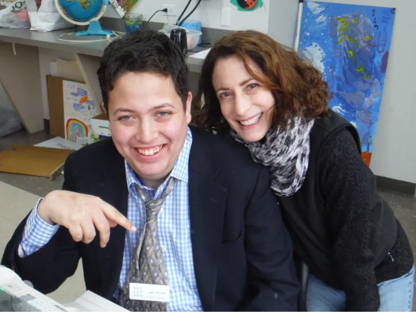 CEL member with volunteer smiling in formal attire.