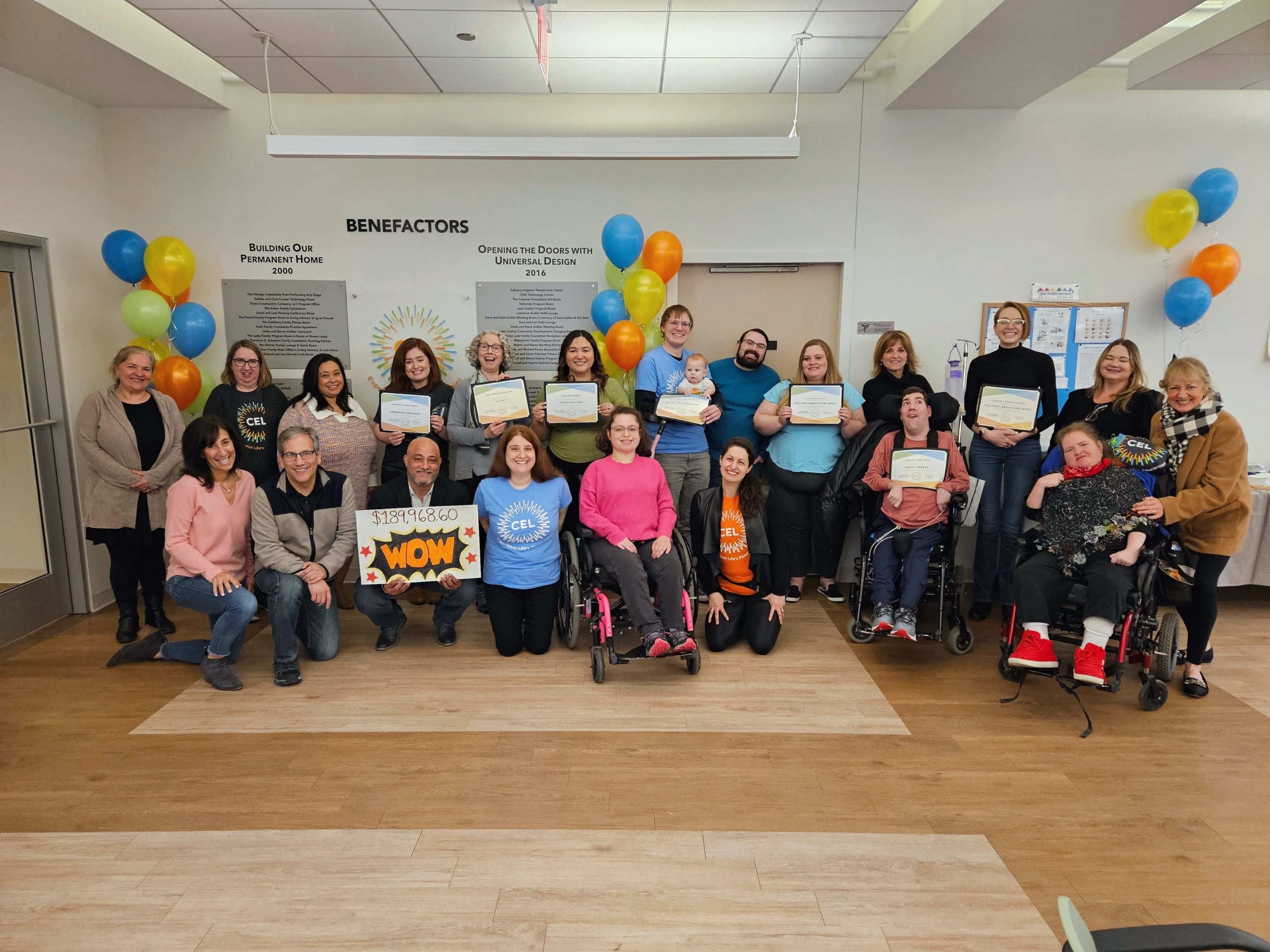 A group of CEL members and staff smiling during fundraiser awards.