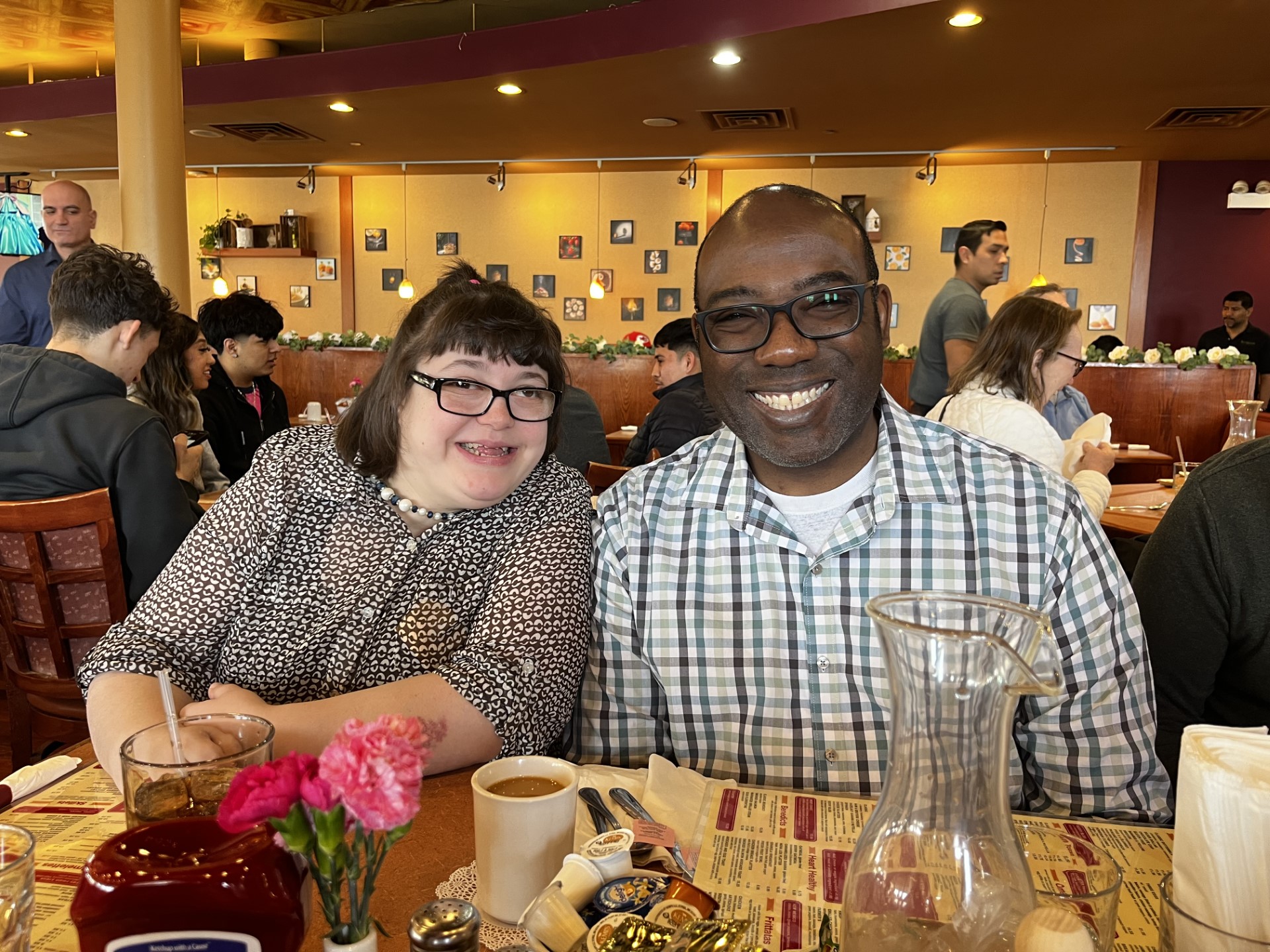 CEL members Anna and William smiling during a brunch excursion.