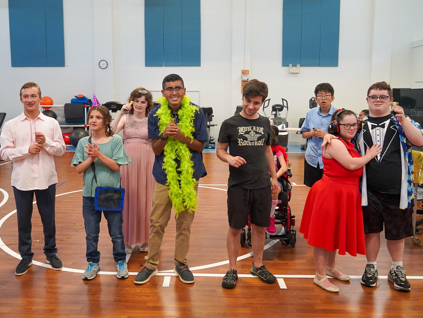 Summer Camp members at CEL Hollywood Gala Event, beaming with joy and pride as they hold their awards and smile for the camera.