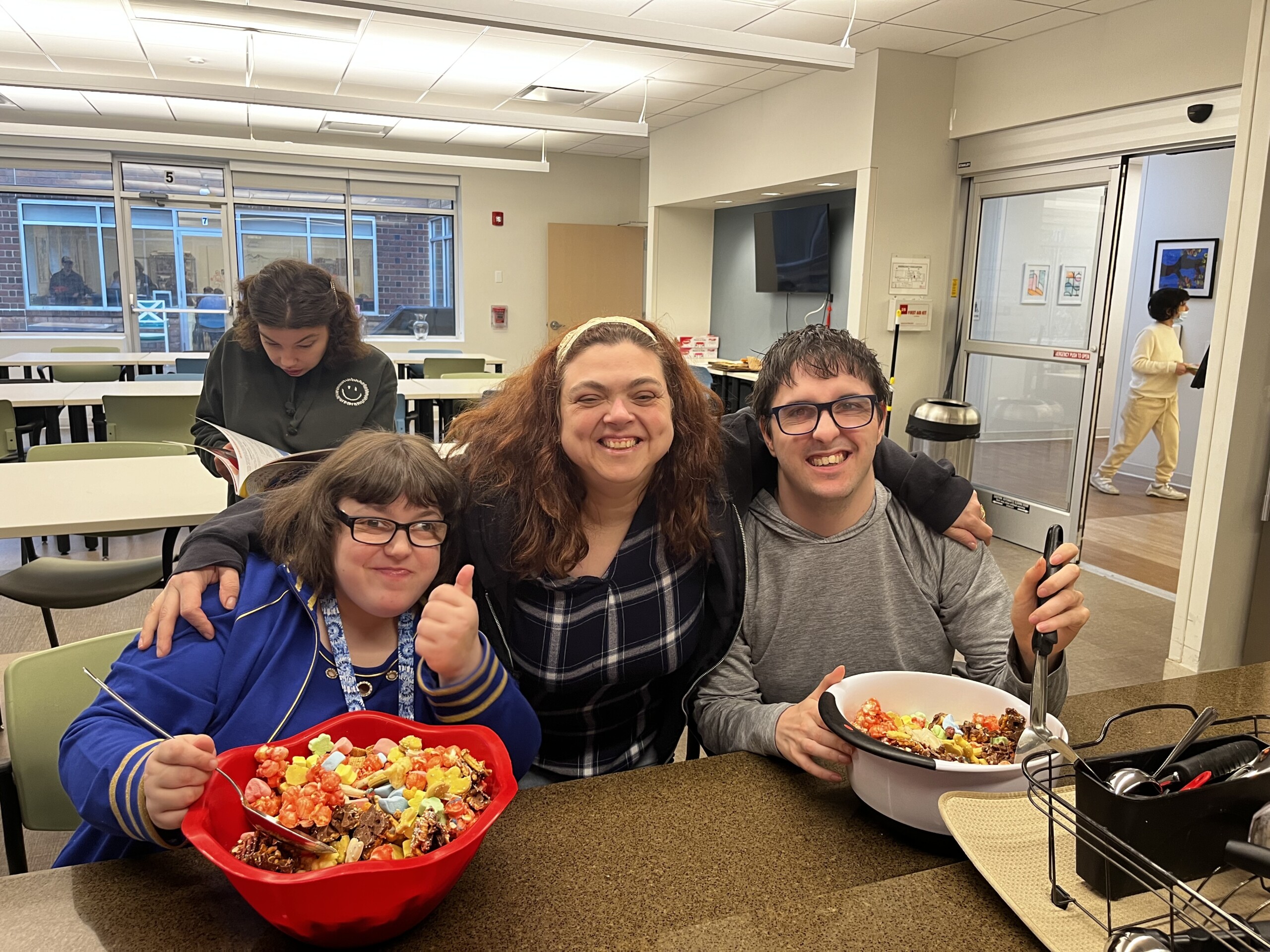 A photo of CEL members and volunteers participating in a cooking activity.