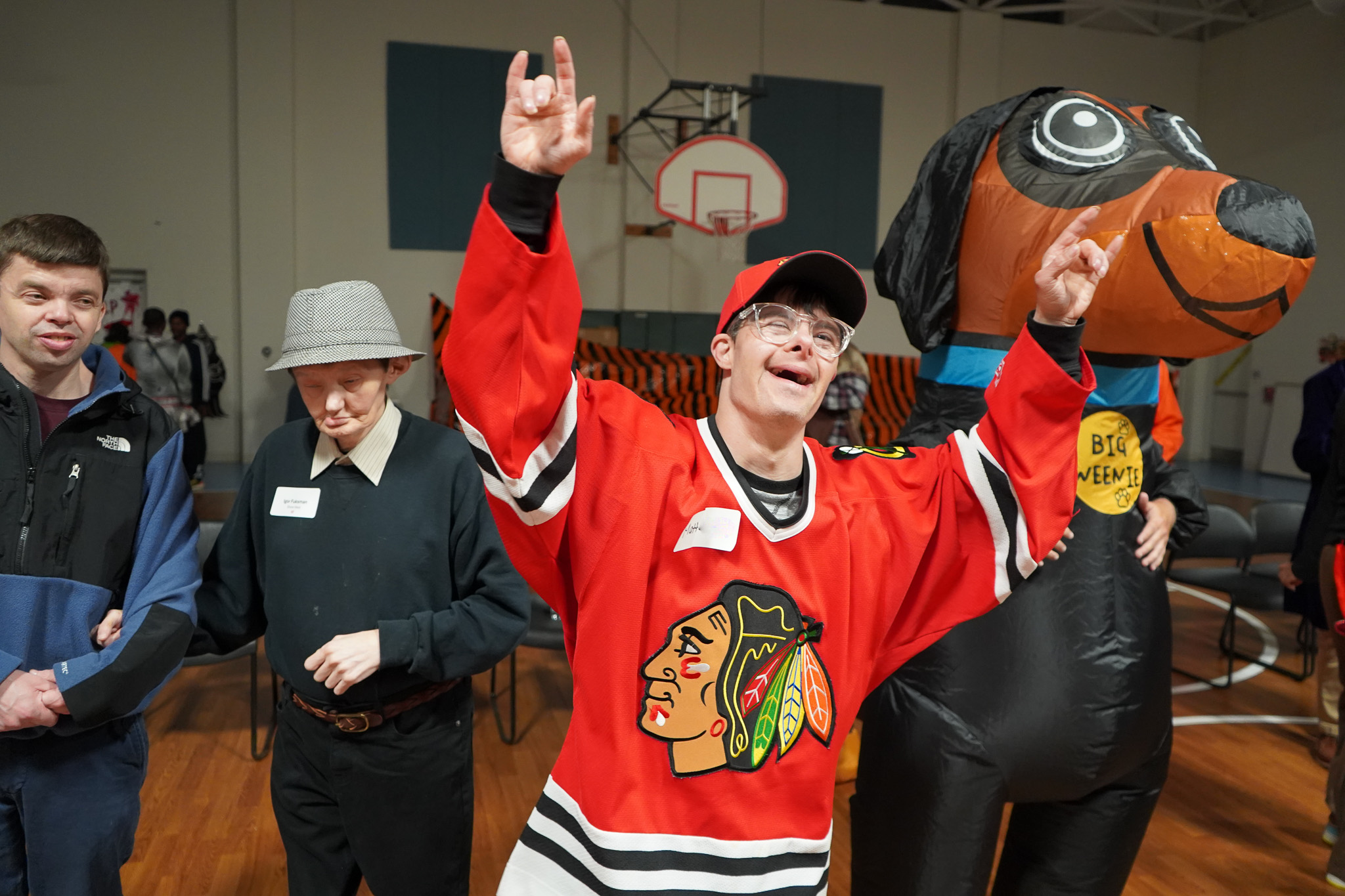 A member dressed as a Chicago Blackhawks hockey player dances at the Harvest Dance