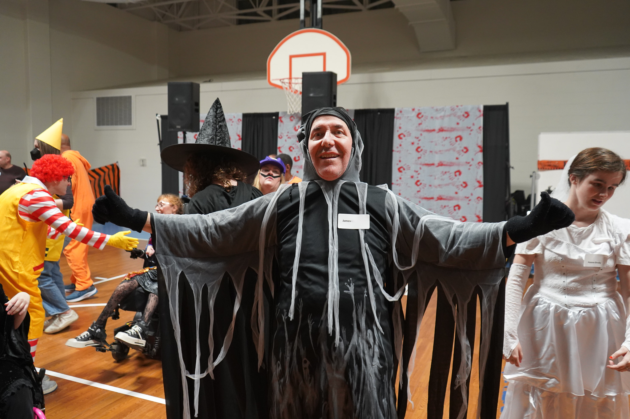 A member poses in a ghoul halloween costumes at the Harvest Dance