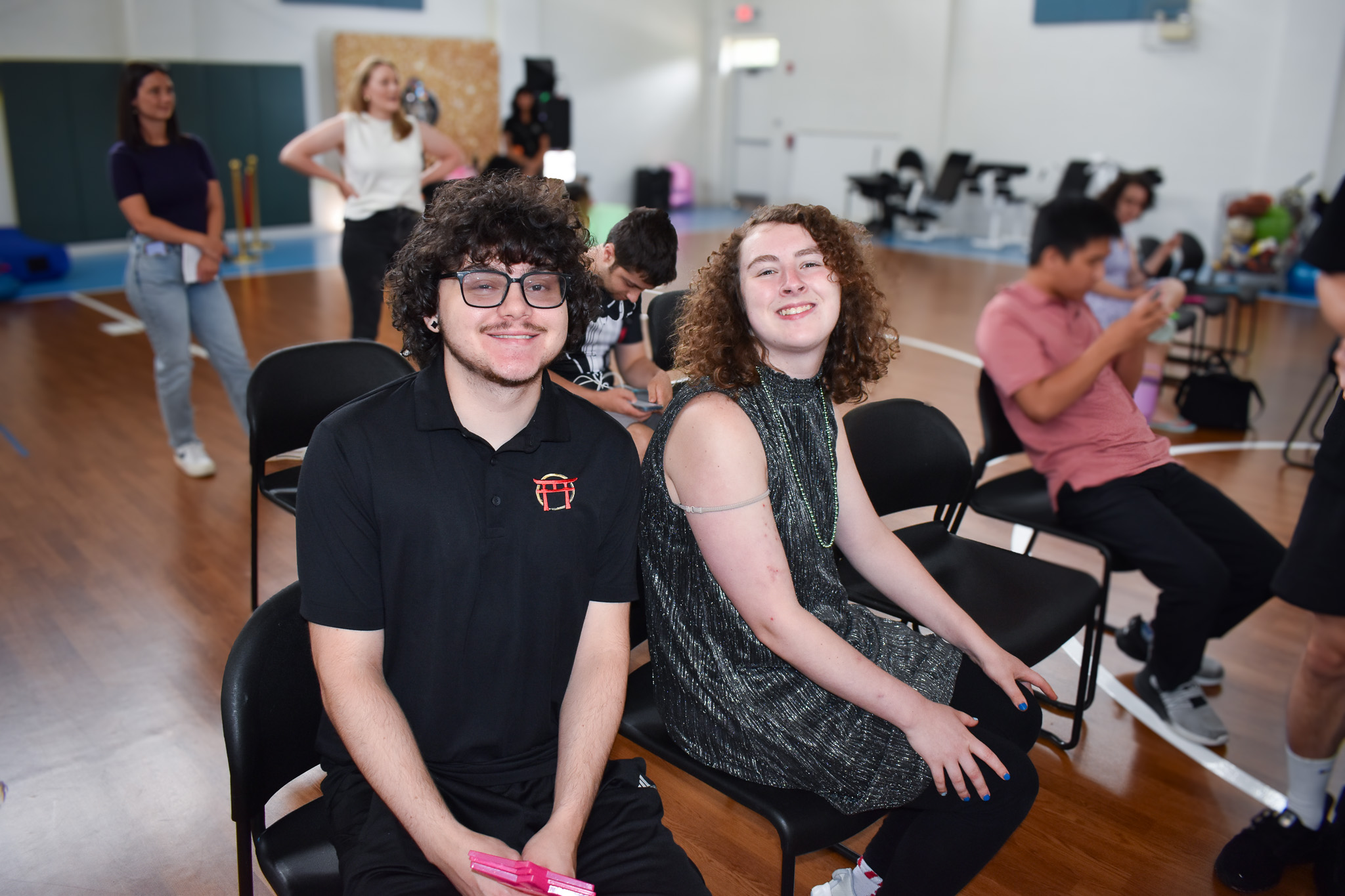 An intern sits next to a member