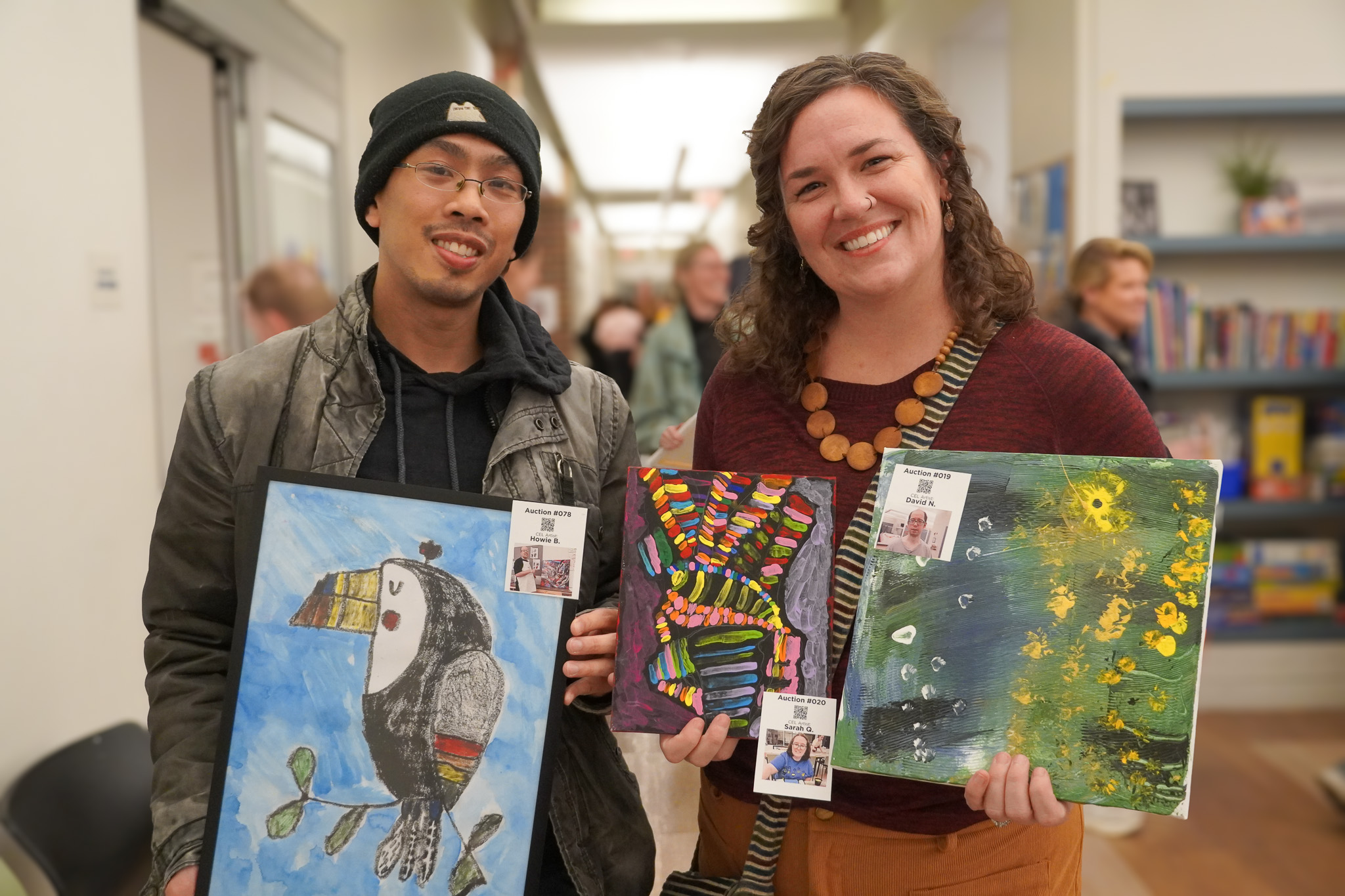 people holding art at Artful Evening