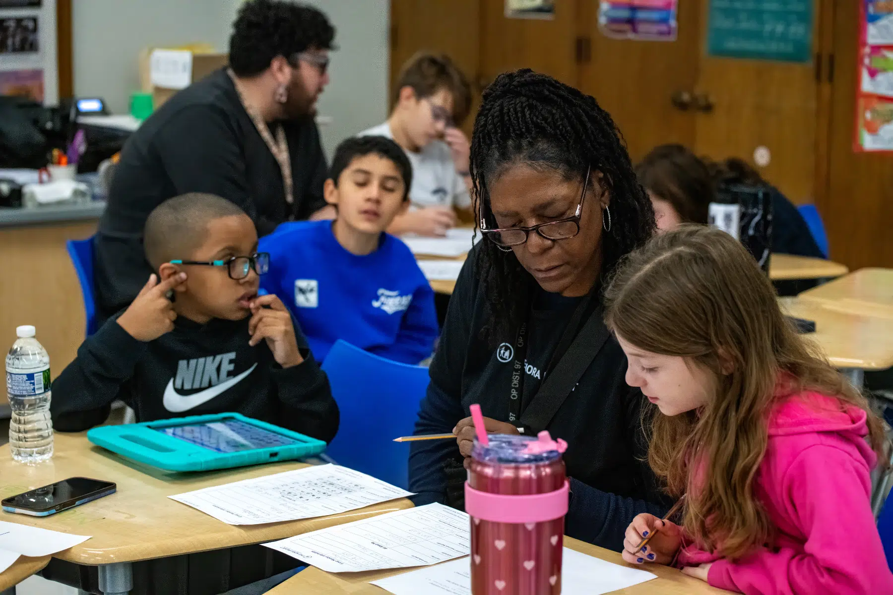 students working with teacher