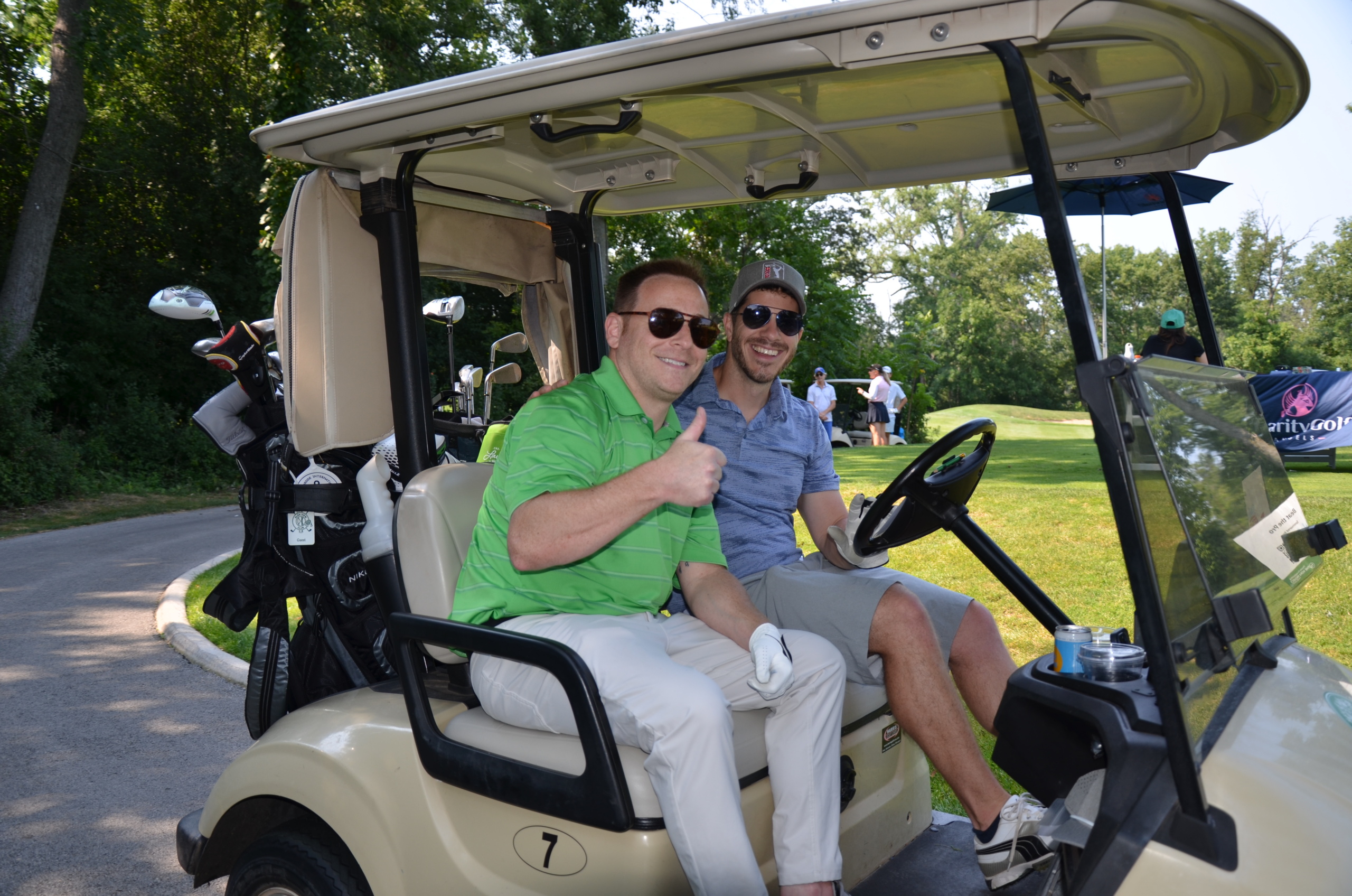 Weinberg Choi golfers in carts