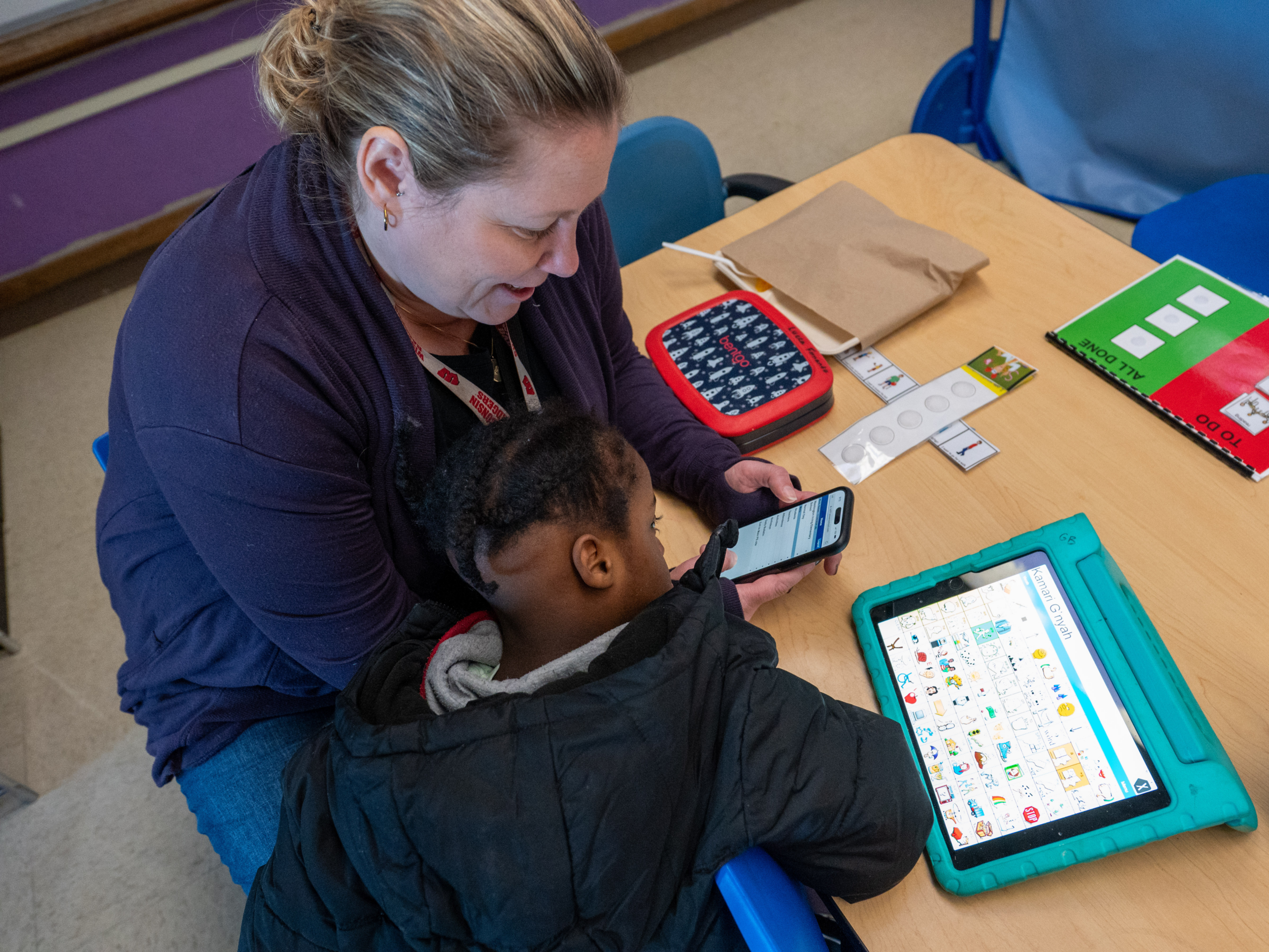 Educator and Student at a desk