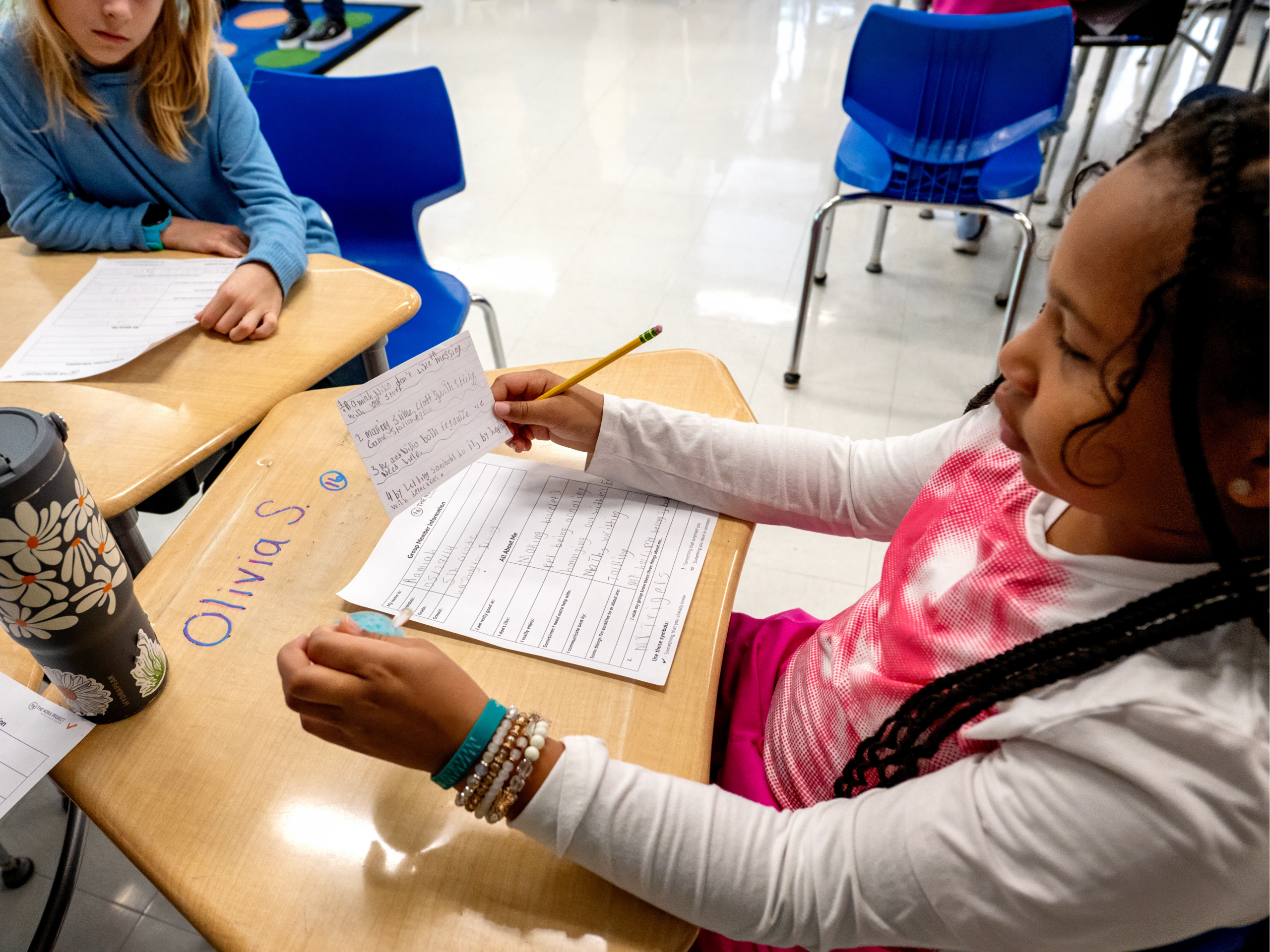 student does an activity on her desk