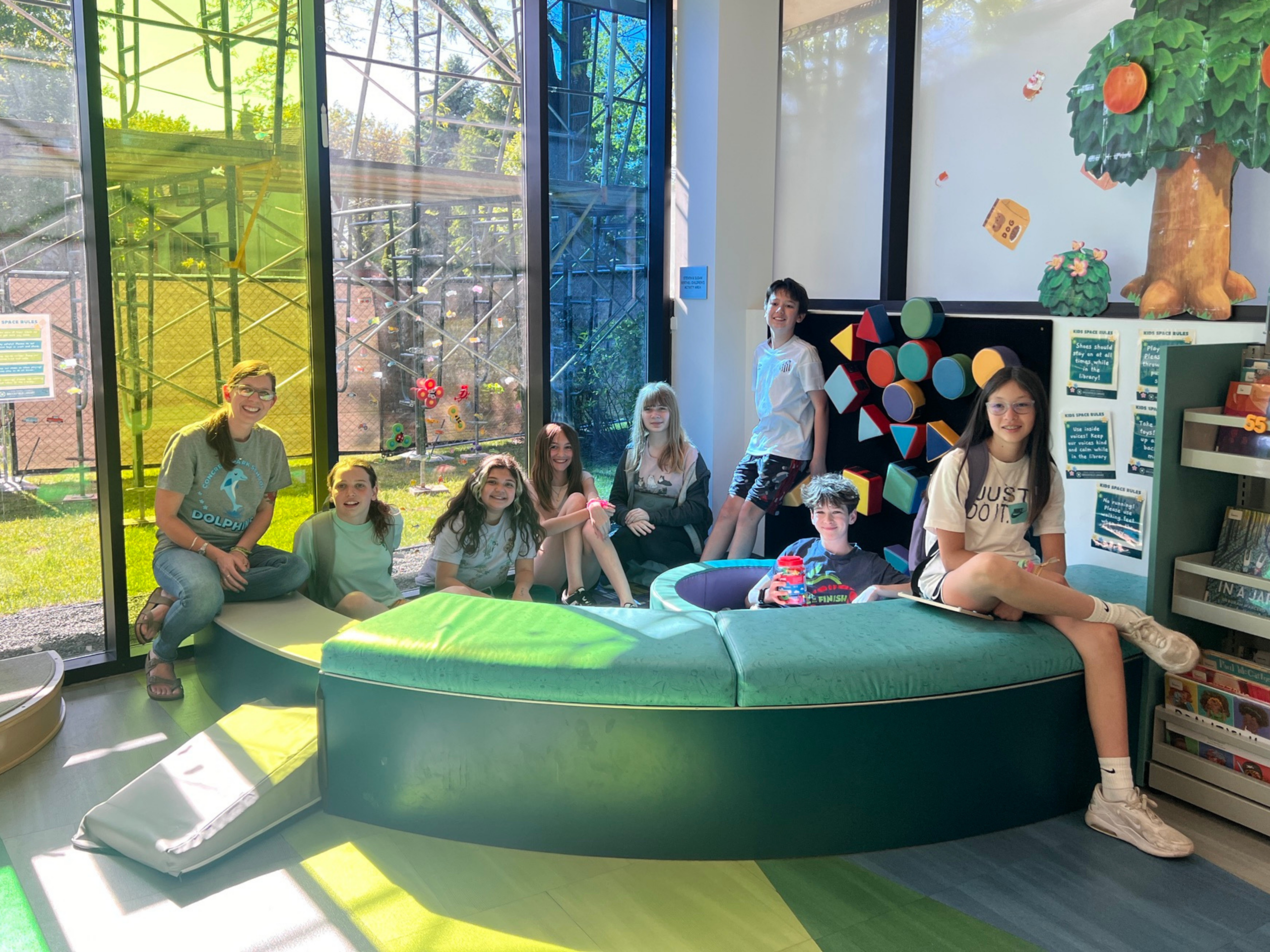 students and educator in library