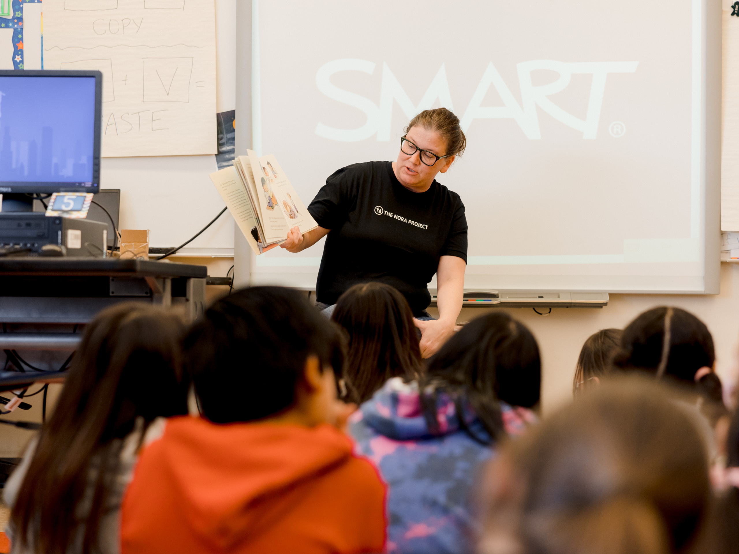 An educator reads to her class